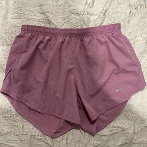 Pink Nike dry fit athletic running shorts with drawstrings and back zipper